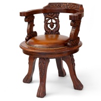 Heavily Carved Fully Rotating Oak Ships Chair with Tan Leather Seat