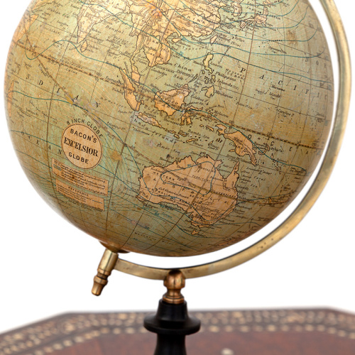 Antique Bacons Excelsior 8" (20.3cm) terrestrial globe mounted on an ebonised stand with brass axis